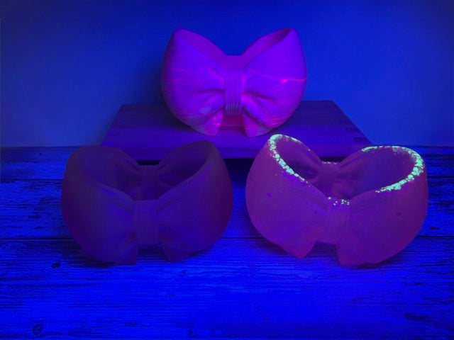 Bow Pencil Holders under Blacklight