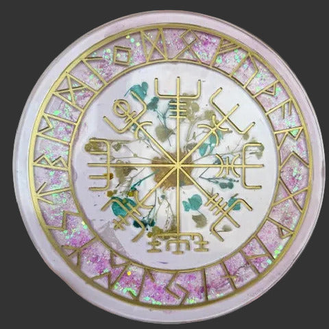 Decorative plate featuring Vegvisir compass and runes set in epoxy, pressed flowers, and hand-painted gold inlay. Shown in natural sunlight.